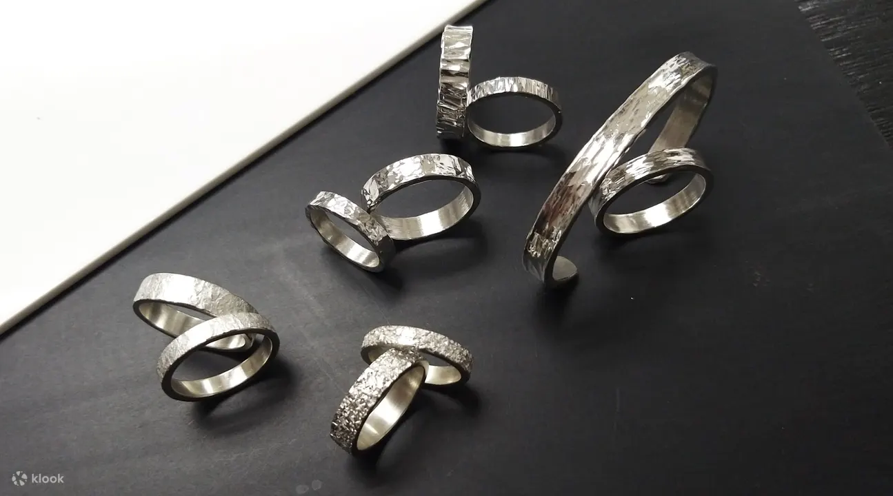 silver rings on a black table